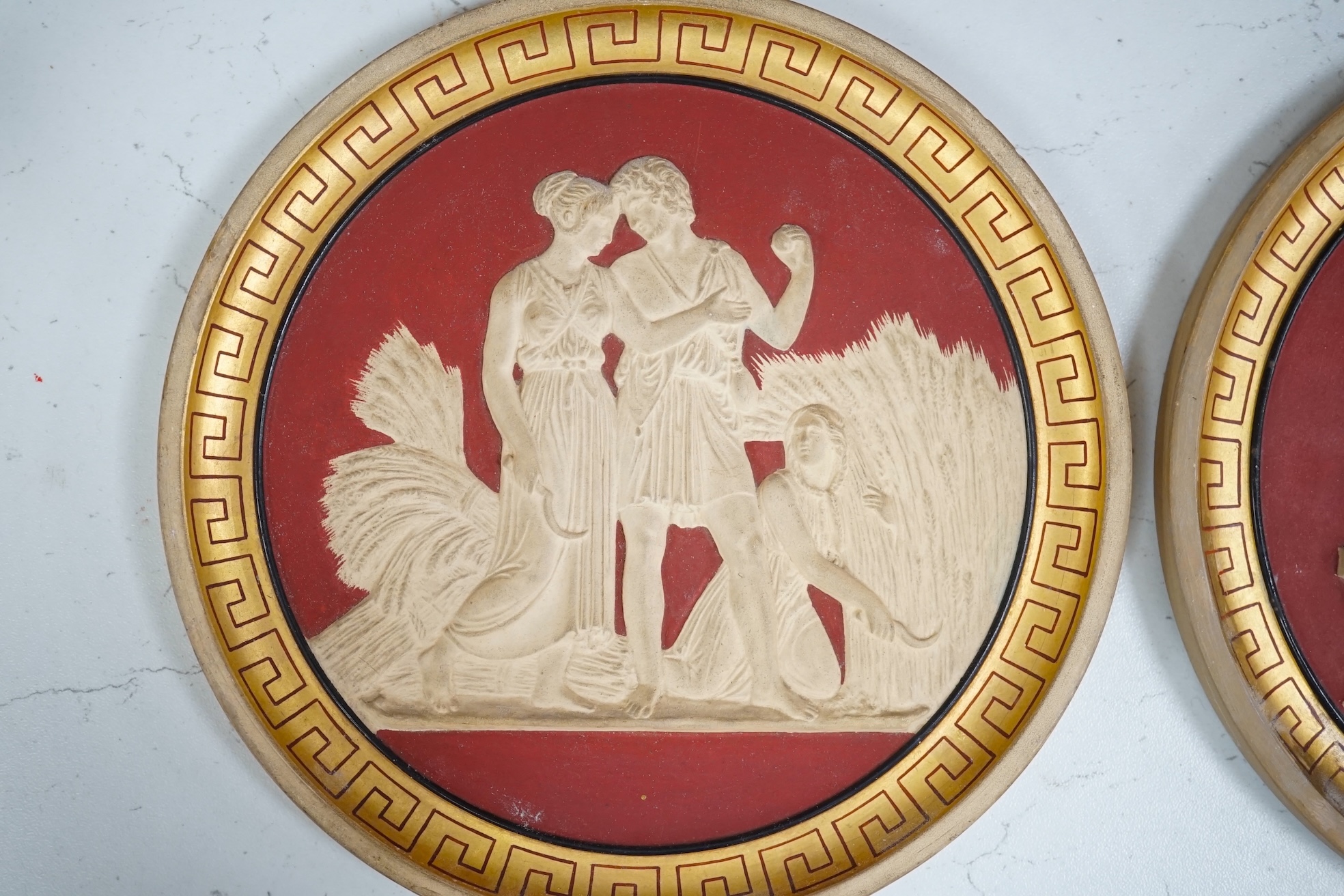 A set of four Neoclassical style terracotta plaques, P. Ipsen, ‘The Four Seasons’, by Bertel Thorvaldsen, each stamped to the base, 17cm in diameter. Condition - some restoration